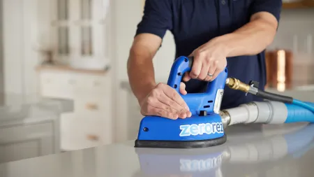 a man using a blue tool