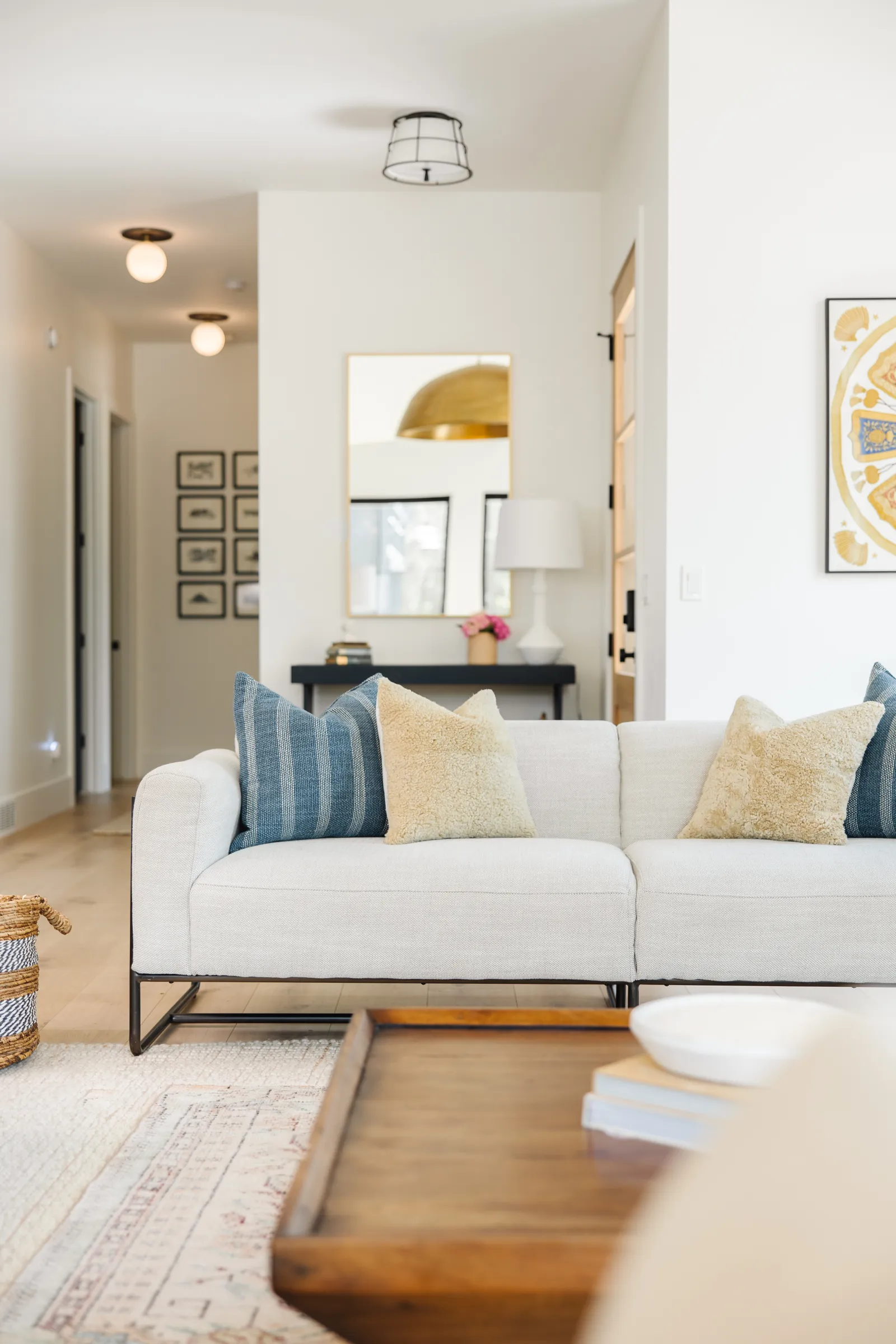 clean living room in home with rug and couch